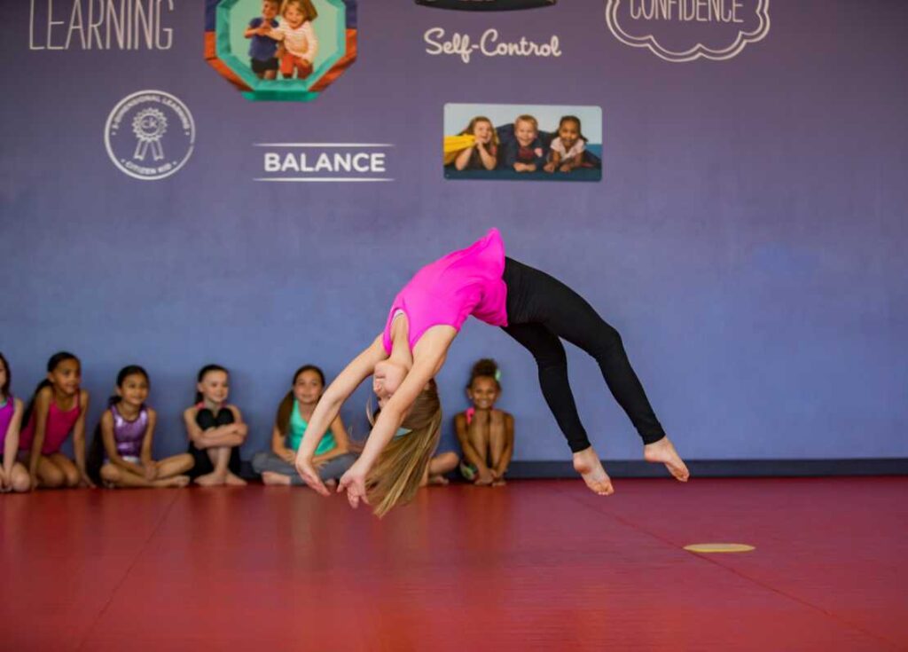 young girl doing a back handspring