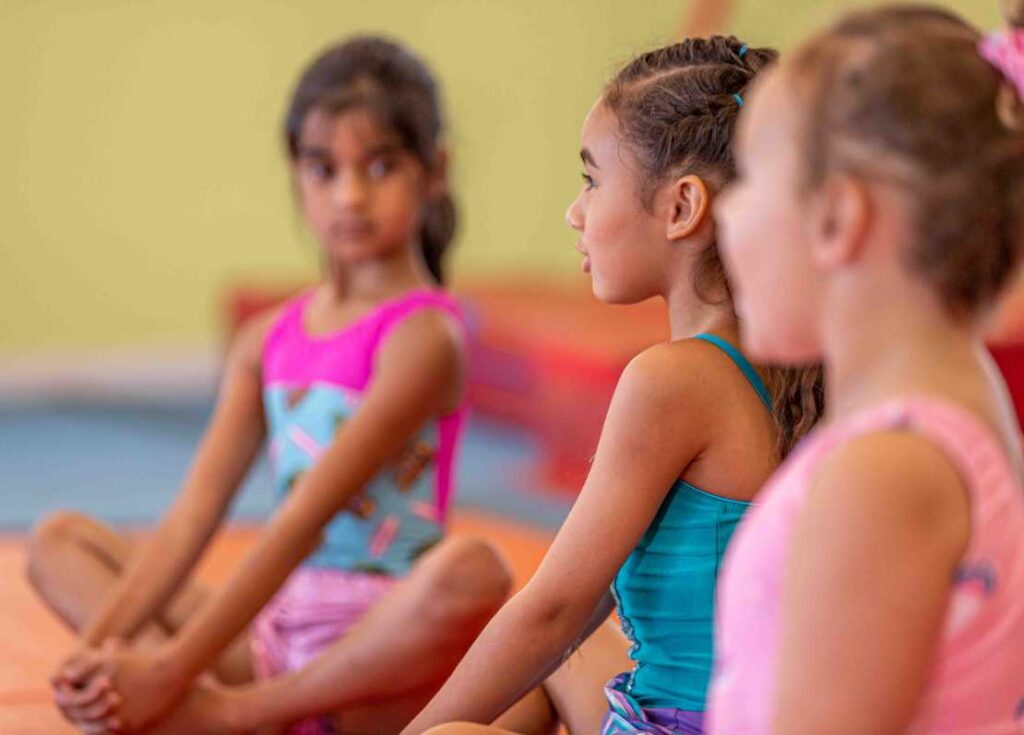 group of girls waiting to start a dance class