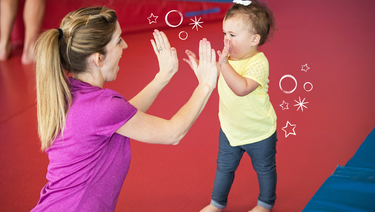 1200x628_pc_girl_rm_highfiveinstructor_nologo young girl high fiving an instructor