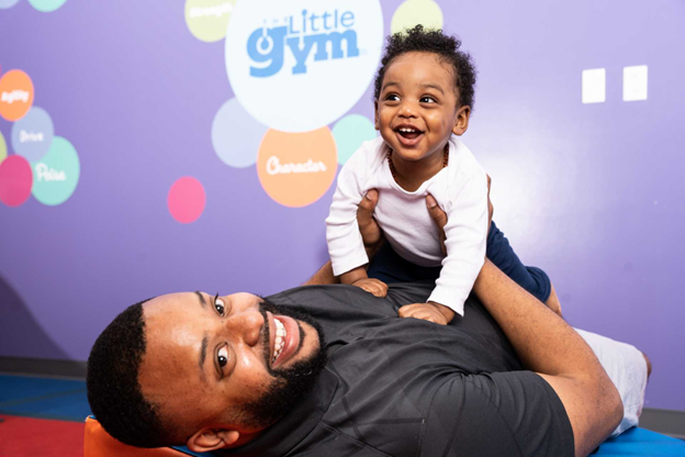 father playing with his infant son